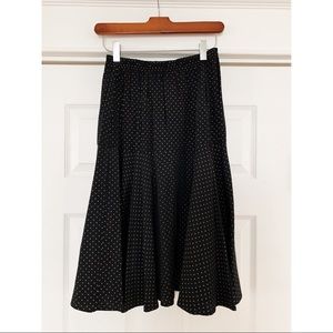 Vintage black skirt with gold polkadots.